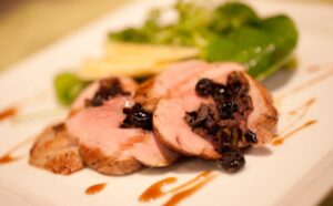 Wild Rice Dried Blueberry Stuffed Pork Tenderloin With Watercress Apple Salad And Apple Cider Vinaigrette